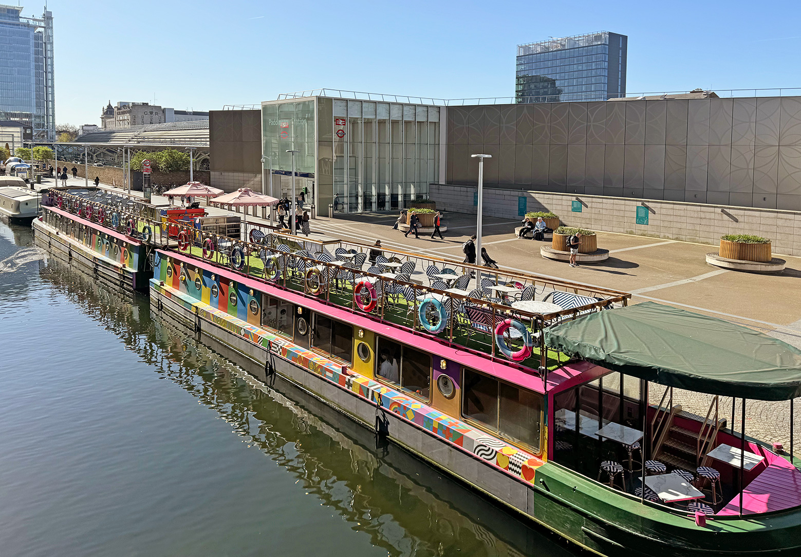 The modern side entrance of Paddington station by the side of the canal